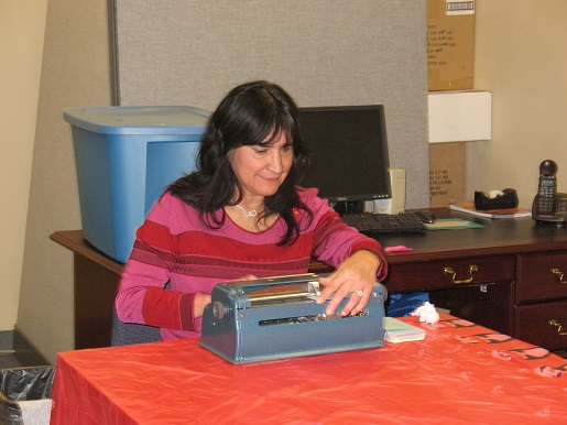 Christine typing Braille on a Perkins Brailler